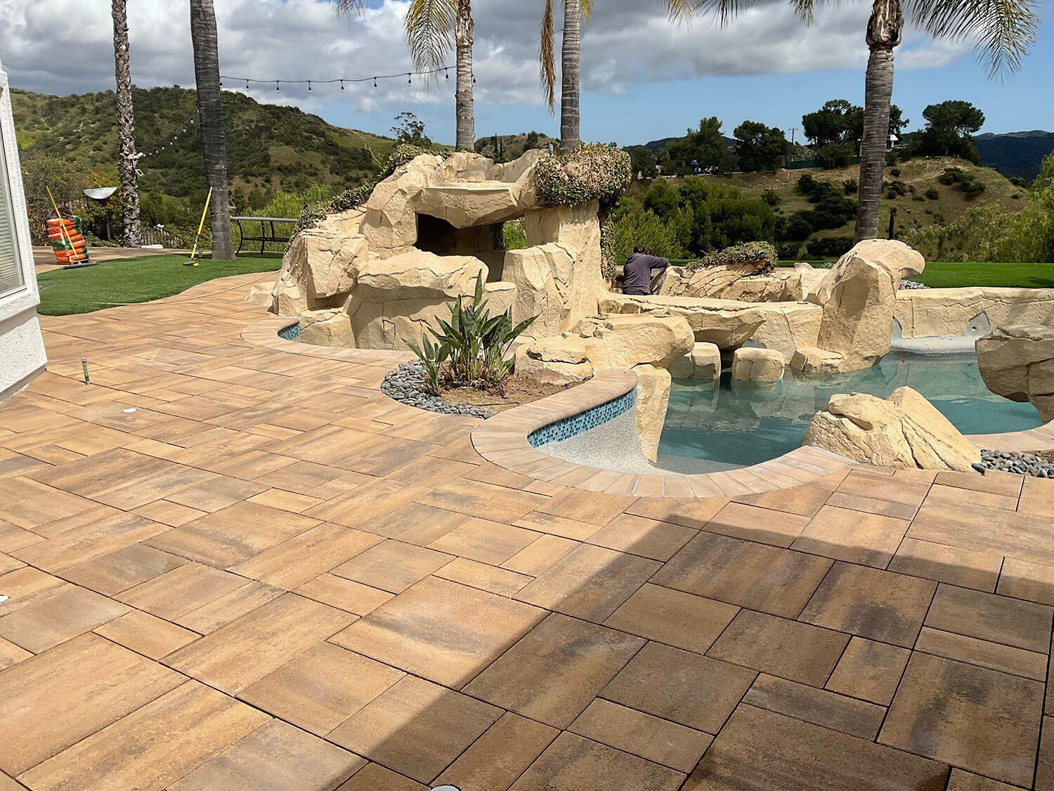 Custom coping installation on a luxury commercial pool in Pasadena